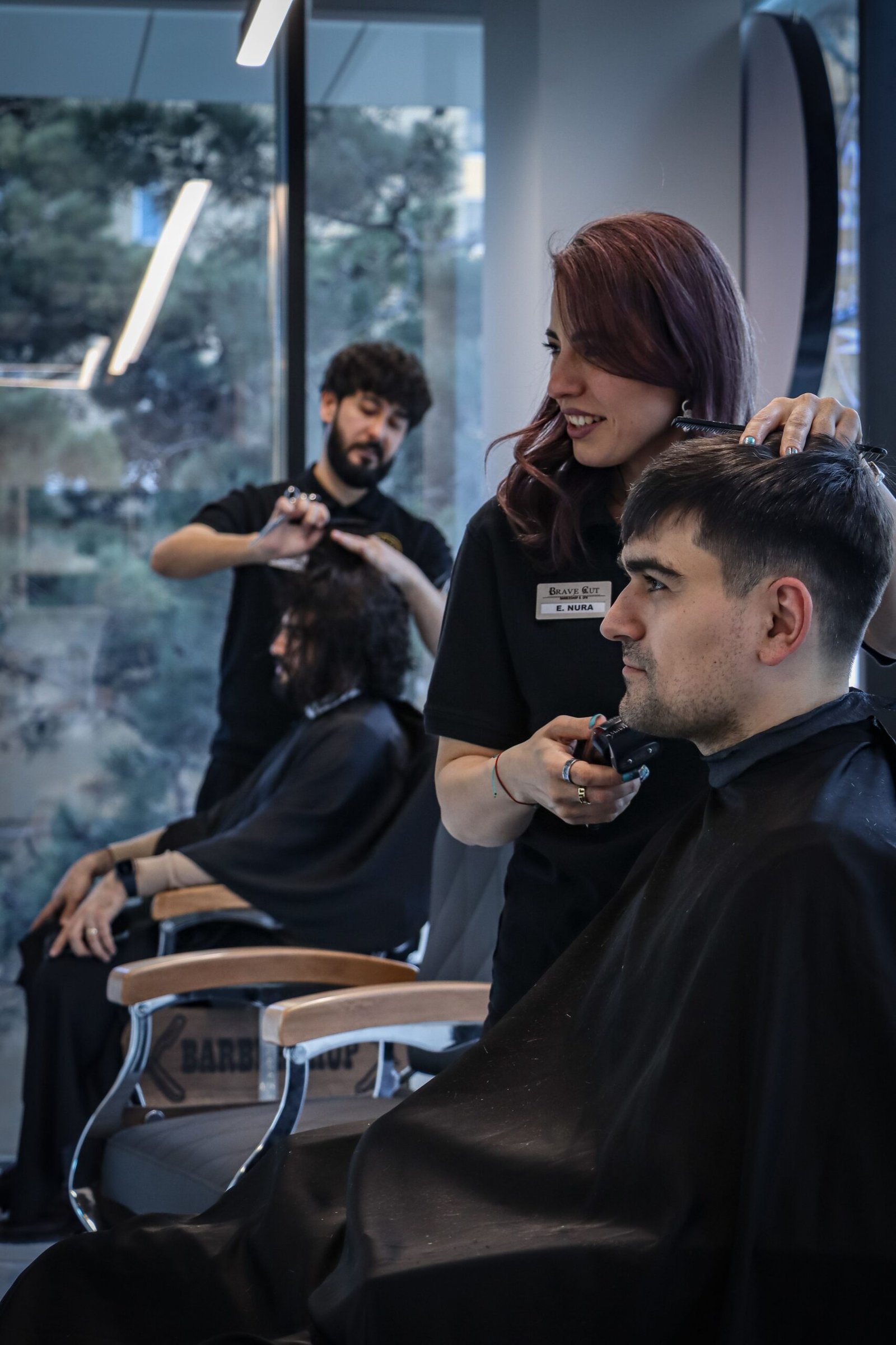 staff scheduling software for salons: two stylists working with clients simultaneously